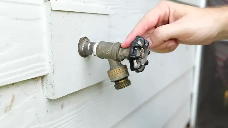 Kitchen faucet supply line connections and shutoff valves inspected for leaks under a Commerce City sink