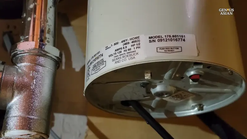Garbage disposal unit with sink flange and drain connections inspected for leaks in a Commerce City kitchen