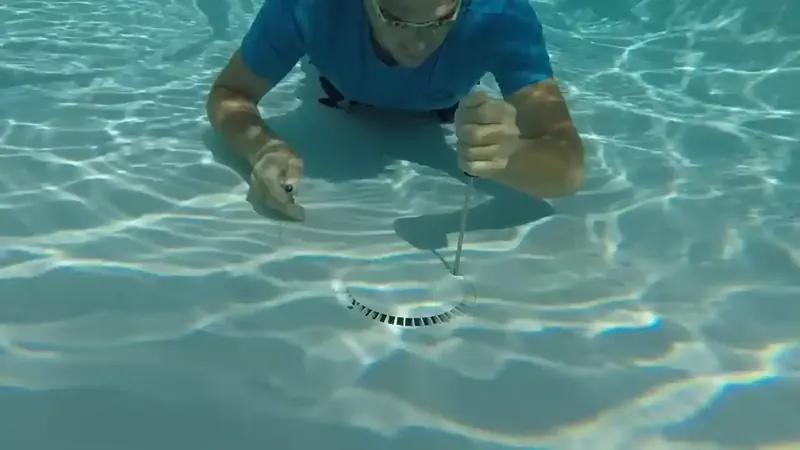 Inground pool skimmer and return fittings inspected for leaks along the waterline in Commerce City