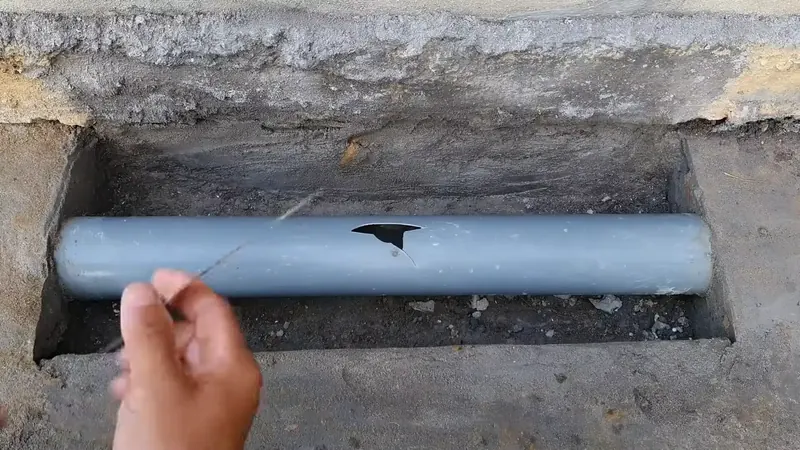 Exposed residential plumbing supply and drain lines in an open wall of a Commerce City home during inspection