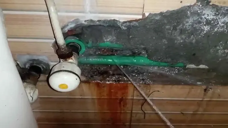 White PVC drain pipe with hub fitting and primer-marked joints inspected for leaks in Commerce City CO