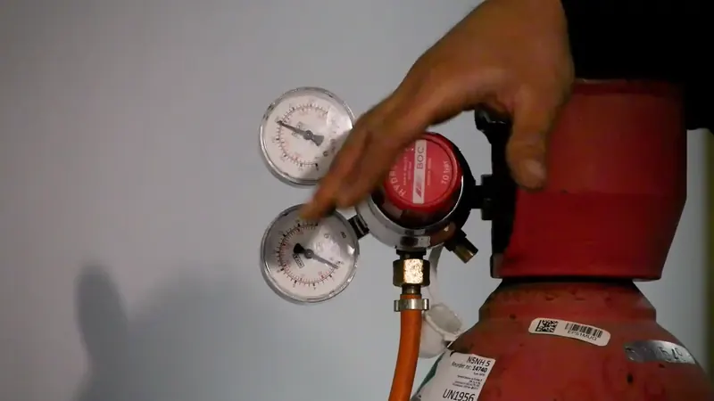 Tracer gas injection equipment connected to a supply line for leak location in a Commerce City Adams County home