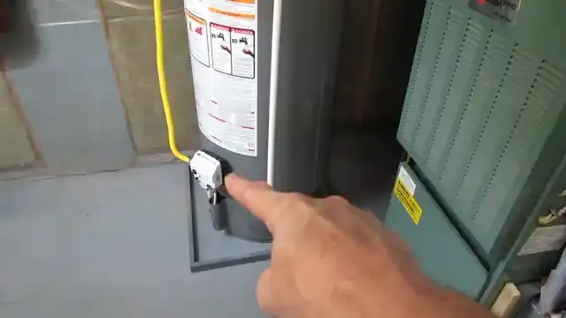 Water heater unit with supply and relief valve connections inspected for active leaks in a Commerce City home