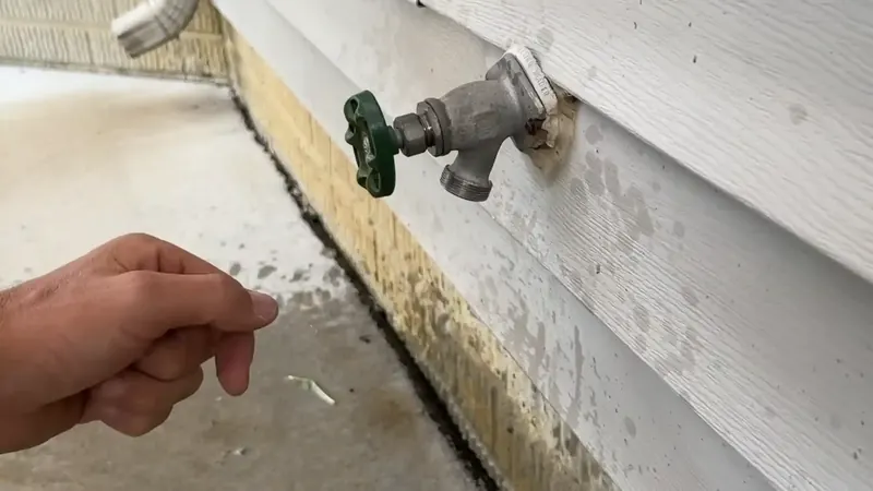 Water meter curb box at a Commerce City home where a spinning flow indicator confirms an active supply leak
